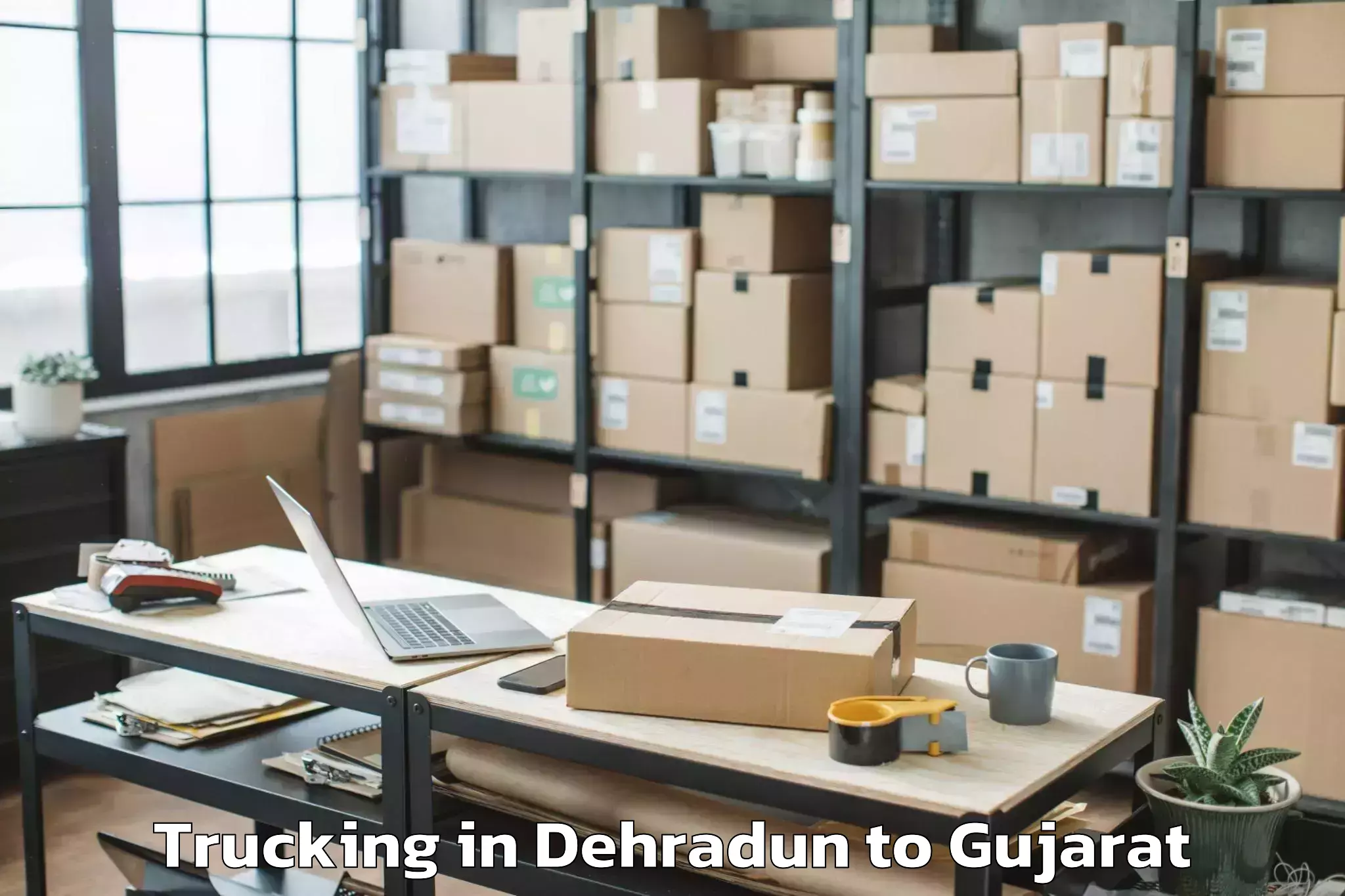 Book Dehradun to Valabhipur Trucking Online